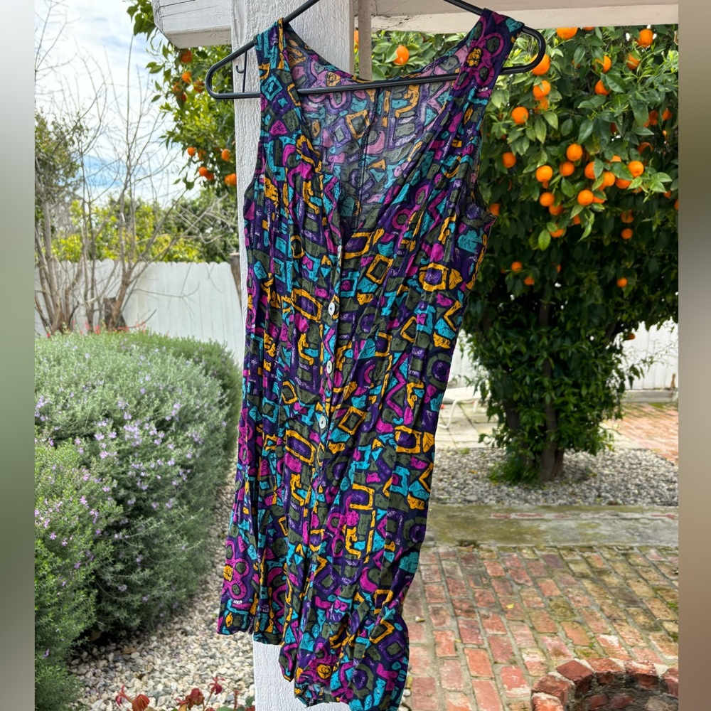 vintage romper, bursting with funky bright colors and retro charm